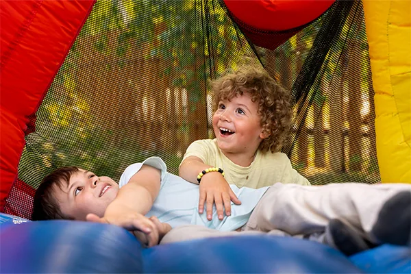 Children enjoying an inflatable rental